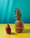 Tropical Pineapple fruit single whole and dragon fruit, pitaya made up of sliceson on a duotone yellow-green background