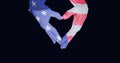 Composition of two hands holding hands decorated with american flag making heart shape on black Royalty Free Stock Photo