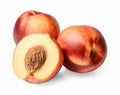 The composition of two whole and one half of nectarines. White isolated background. Close-up.