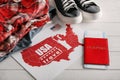 Composition with USA map, clothes and passport on wooden background. Travel planning