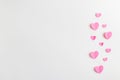 Composition for Valentine`s Day February 14th. Delicate composition of pink hearts made of paper on a white background Royalty Free Stock Photo