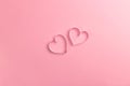 Composition for Valentine`s Day February 14th. Delicate pink background and pink hearts cut out of paper. Greeting card Royalty Free Stock Photo