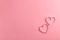 Composition for Valentine`s Day February 14th. Delicate pink background and pink hearts cut out of paper. Greeting card Royalty Free Stock Photo