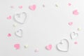 Composition for Valentine`s Day February 14th. Delicate composition of pink hearts made of paper on a white background Royalty Free Stock Photo