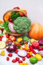 Composition with variety of fresh organic vegetables in wicker basket isolated on white Royalty Free Stock Photo