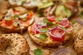 Composition of various homemade bagels sandwiches with sesame and poppy seeds