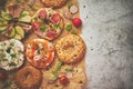 Composition of various homemade bagels sandwiches with sesame and poppy seeds