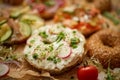 Composition of various homemade bagels sandwiches with sesame and poppy seeds