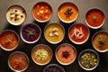 Composition with various soups, ingredients and space for text on black background. Healthy food, high definition soups