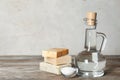 Composition with vinegar, baking soda and soap bars for cleaning on table. Royalty Free Stock Photo