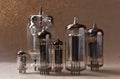 Composition of vintage electronic vacuum tubes on kraft paper background. Royalty Free Stock Photo