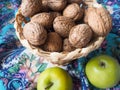 A composition of walnuts in a basket