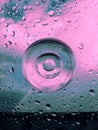 composition of water drops, glass circles in blue and pink color