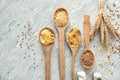 Composition with wheat flour, grains and pasta on wooden background