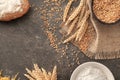 Composition with wheat grains, flour and products on grey background Royalty Free Stock Photo