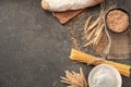 Composition with wheat grains, flour and products on grey background Royalty Free Stock Photo