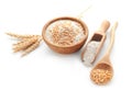 Composition with wheat spikelets, grains and flour on white background