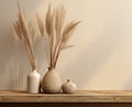 Composition of white ceramic vase with bouquet of dry spikelets, golden photo frame with dried flower, candles on wooden Royalty Free Stock Photo