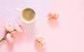 Composition of white cup with black coffee and flowers on a light pink background Royalty Free Stock Photo