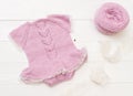 Composition of white-pink knitted suit and hat Royalty Free Stock Photo