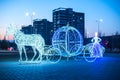 Composition in the winter in the city on the theme of Cinderella from a horse carriage and Cinderella glows in the evening Royalty Free Stock Photo