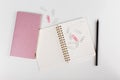 Composition with womens business accessories. note pad, pencil, paper clips on white background. top view. flat lay Royalty Free Stock Photo