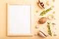 Composition with wooden frame, seashells, green boxwood. mockup on orange background. top view, copy space