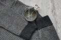 Woolen sweatshirt , a bottle of perfume.