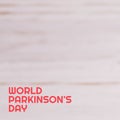 Composition of world parkinson\'s day text and copy space on grey background Royalty Free Stock Photo