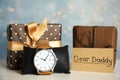 Composition with wristwatch and gift boxes on table. Happy father`s day Royalty Free Stock Photo