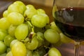 Composition of yellow muscat grape and glass of red wine - close up Royalty Free Stock Photo