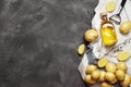 Composition of young potatoes, spices, butter on a gray