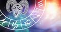 Composition of zodiac wheel with aries star sign over stars