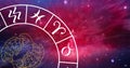 Composition of zodiac wheel with pisces star sign over stars Royalty Free Stock Photo