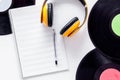 Compositor`s workplace. Vinyl records, headphones, music notes on white background top view Royalty Free Stock Photo