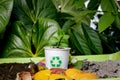 Compost and composted soil cycle as a composting pile of rotting kitchen scraps with fruits and vegetable garbage waste turning Royalty Free Stock Photo