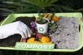 Compost and composted soil cycle as a composting pile of rotting kitchen scraps with fruits and vegetable garbage waste turning Royalty Free Stock Photo