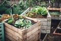 composting system in a small urban garden with herbs and vegetables