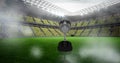 Compostion of cup over football stadium and white blur Royalty Free Stock Photo