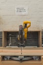 Mitre saw on wooden bench with Aluminium cutting blade.