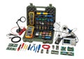 Comprehensive electronics toolkit with multimeter, soldering iron, and various components laid out on a white background Royalty Free Stock Photo