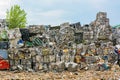 Compressed aluminium scrap in large cubes forming landfill in piles. Royalty Free Stock Photo