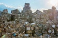 Compressed aluminium scrap in large cubes forming landfill in piles. Royalty Free Stock Photo