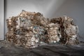 Compressed bales of used polyethylene packaged for further processing workshop of a modern waste recycling plant with copy space.