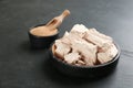 Compressed and granulated yeast on black table