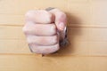 Compressed hand in a fist punch board Royalty Free Stock Photo