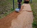 compressing the gravel of the new park threshing path. lawn seed is