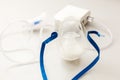 Compressor nebulizer with mask on table