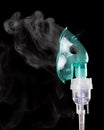 Compressor nebulizer at work, isolated on black Royalty Free Stock Photo
