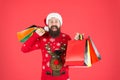 Compulsive buyer. Retail. Almost christmas. Presents for family. Bearded hipster carry shopping bags. Santa man bought Royalty Free Stock Photo